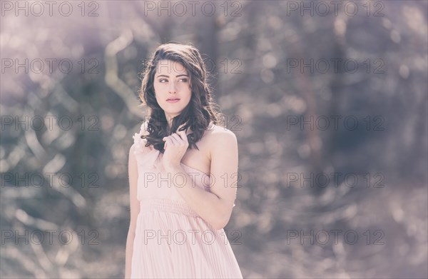 Young woman wearing a pink dress