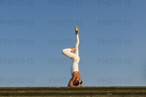 Young woman practising Hatha yoga