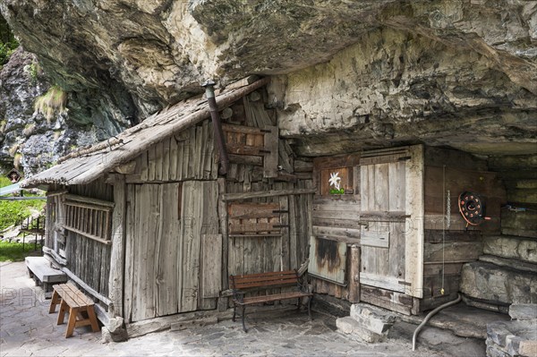 Wooden hut with cliffs