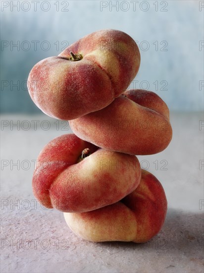 Pile of fresh donut peaches