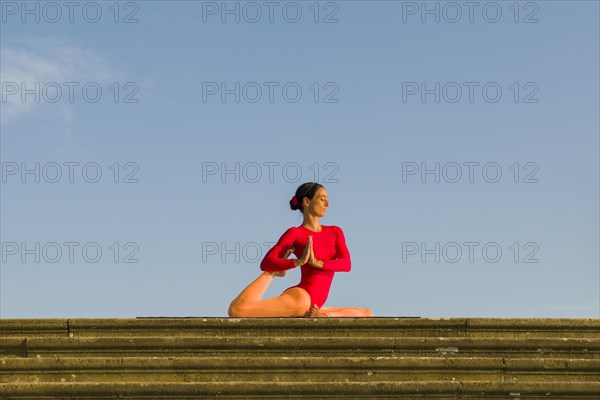 Young woman practising Hatha yoga