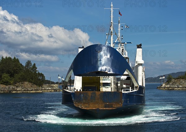 Ferry approaching the pier with an open bow section