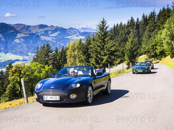 Aston Martin DB7 Vantage Volange cars on a mountain road near Kitzbuhel