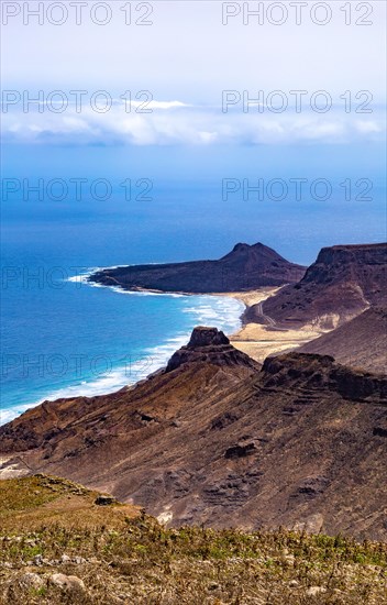 Beach Praia Grande between volcanic mountains