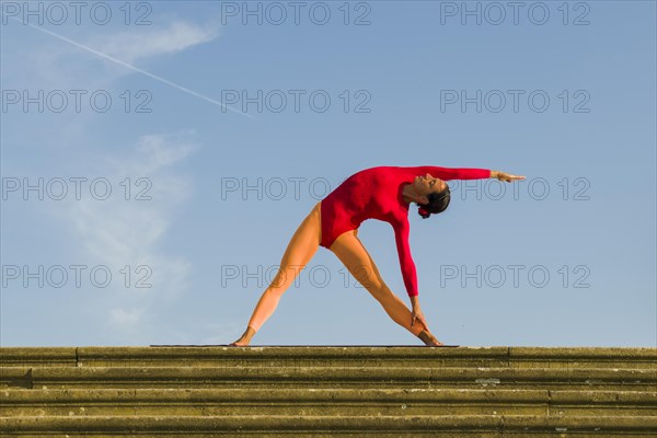 Young woman practising Hatha yoga