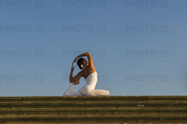 Young woman practising Hatha yoga