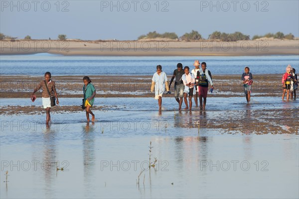Malagasy people crossing the water