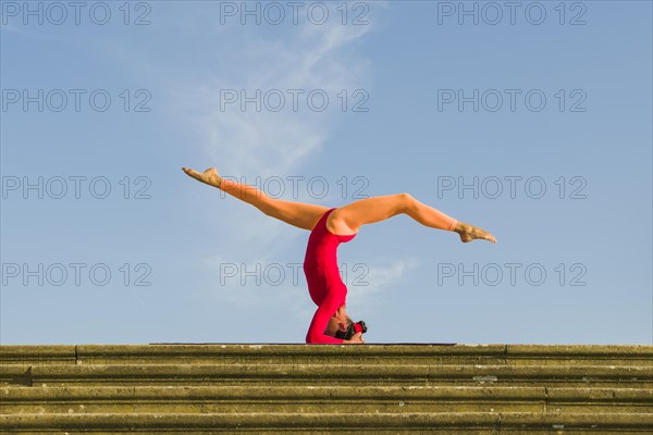 Young woman practising Hatha yoga