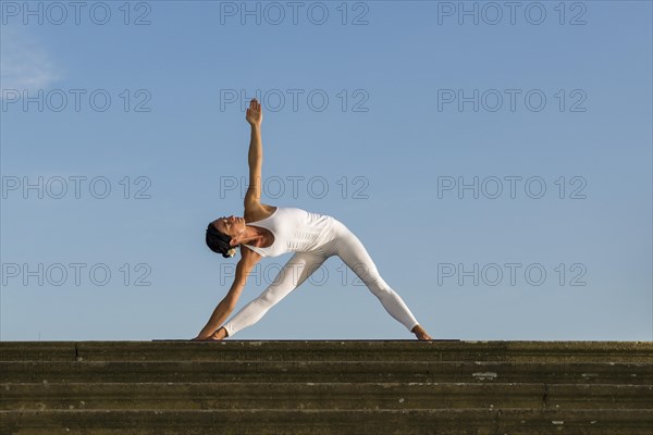 Young woman practising Hatha yoga