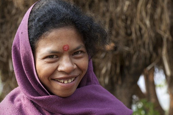 Nepalese woman with purple headscarf