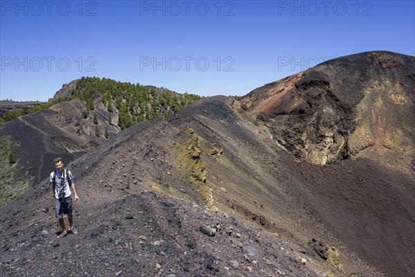 Hikers on a trail at the crater of the Duraznero volcano