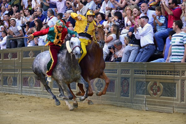 Overtaking manoeuvre of the winner at the historic horse race Palio di Siena