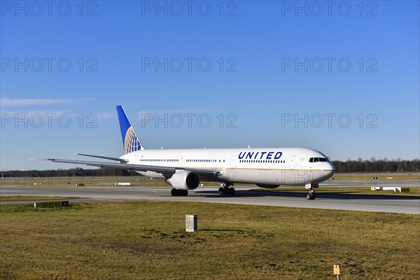 United Airlines Boeing B 767 rolling on the taxiway towards runway