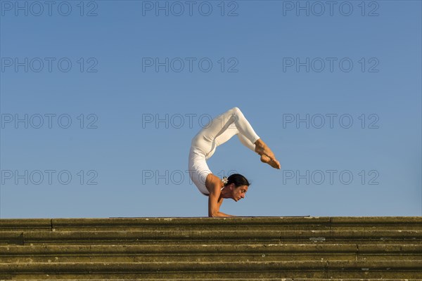 Young woman practising Hatha yoga