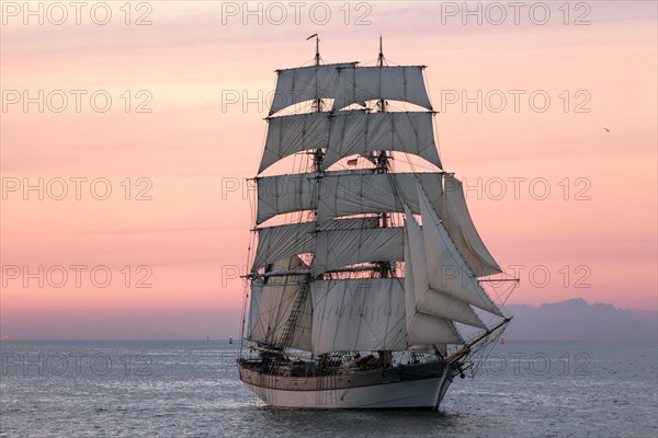 Evening sailing with a two-master in full sail at the Hanse Sail 2014 Warnemunde