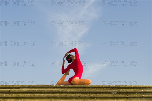 Young woman practising Hatha yoga