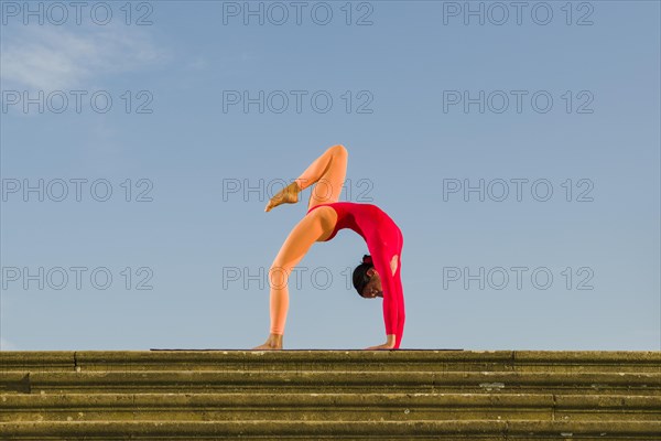 Young woman practising Hatha yoga