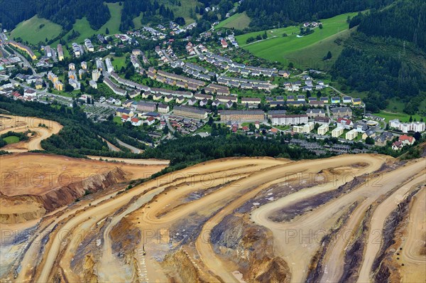 Open pit ore mining and workers' settlements