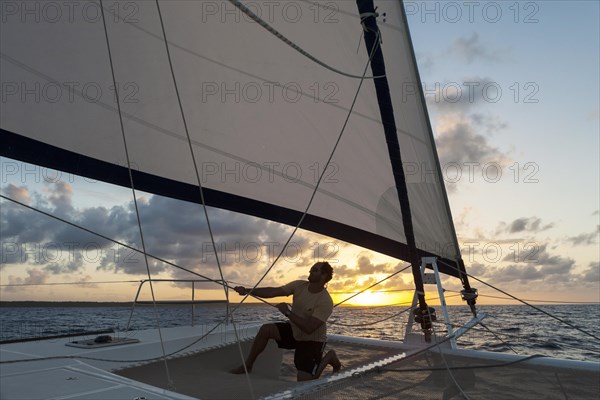 Skipper checking the tension of the sails