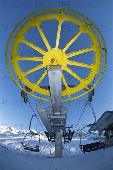 Yellow return bullwheel at terminus