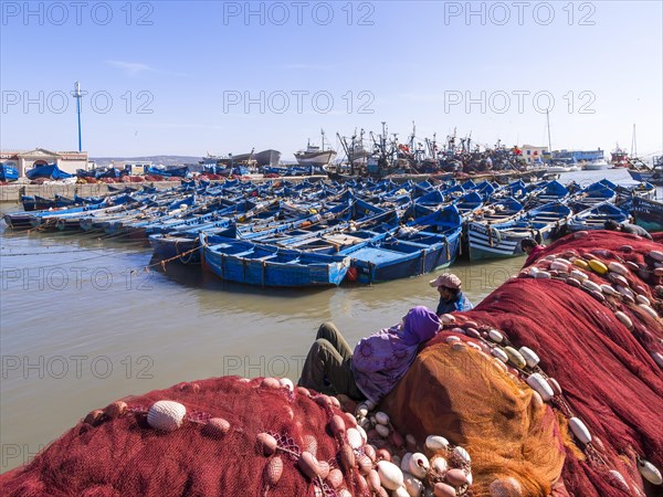 Old blue fishing boats in the port of Essaouira