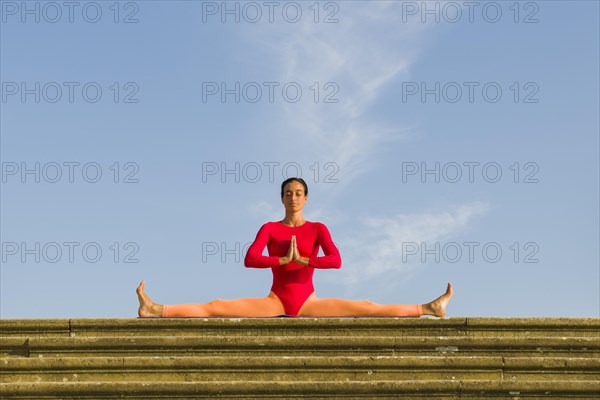 Young woman practising Hatha yoga