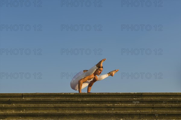 Young woman practising Hatha yoga