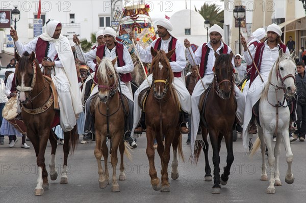 Men on horseback