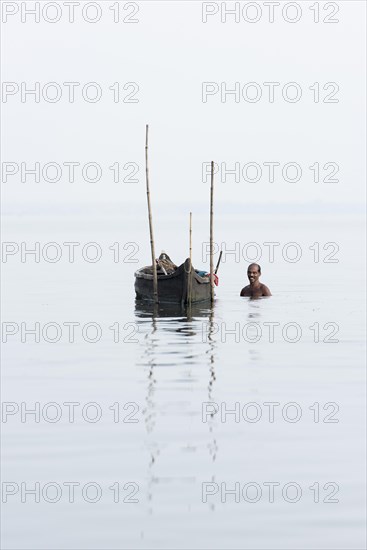 Cockle picker at his boat