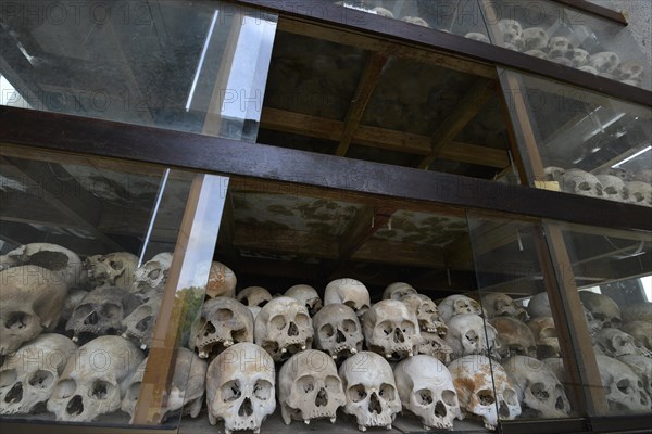 Skulls and bones in the Memorial Stupa to the prisoners murdered by the Communist or Maoist Khmer Rouge in Choeung Ek