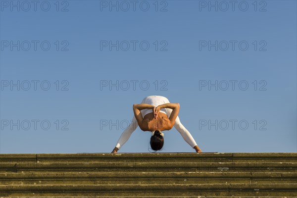 Young woman practising Hatha yoga