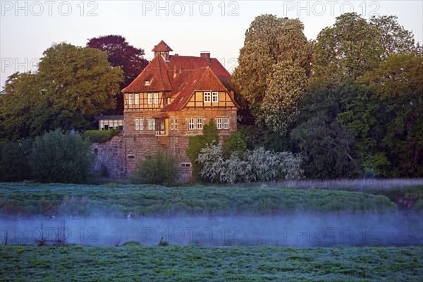 Petershagen Castle on the River Weser at sunrise