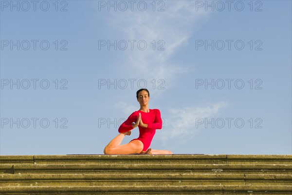 Young woman practising Hatha yoga