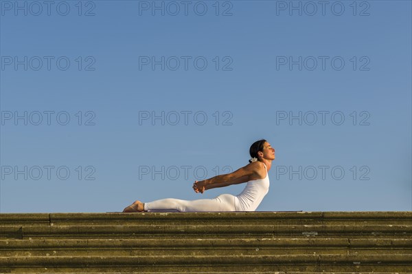 Young woman practising Hatha yoga