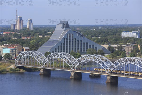 Daugava River with the Railway Bridge or DzelzceÄ¼a Tilts and the New National Library