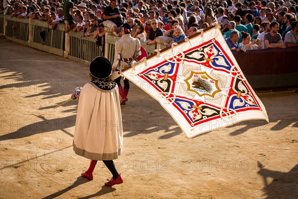 Man carrying a flag from the Crested Porcupine or Istrice contrade