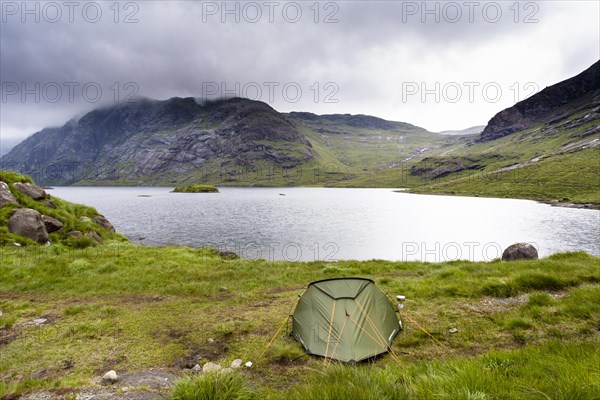 Tent next to Loch Coruisk with Cuillin Hills behind