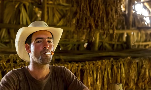 Tobacco farmer Luis Manne Alvares Rodrigues smoking a Havana cigar