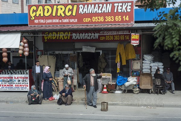 People waiting for a shared taxi