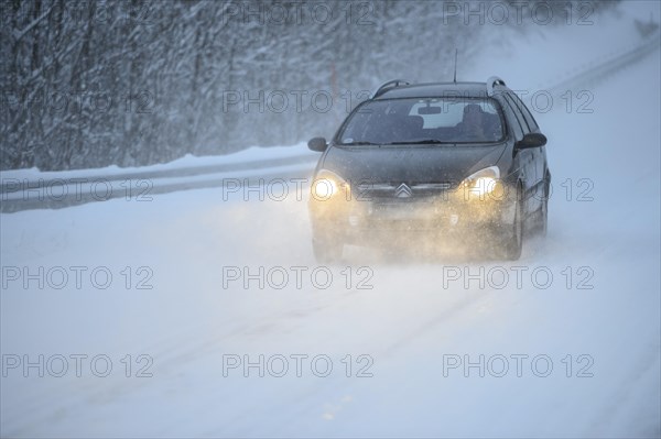 Truck driving on snowy road