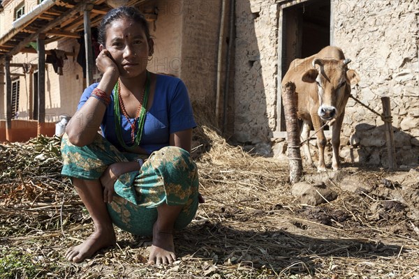 Nepalese farmer with cow on Nagarkot