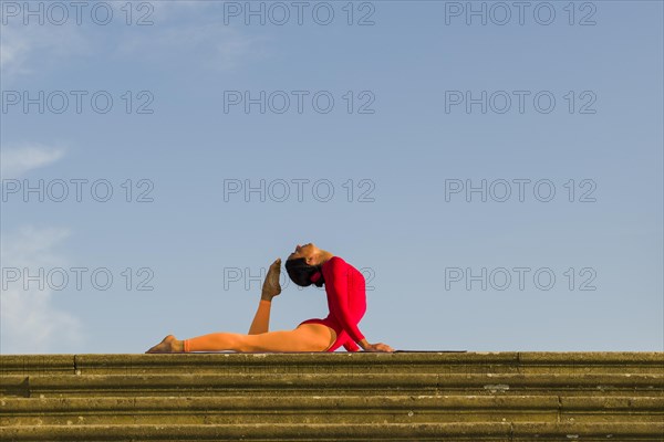 Young woman practising Hatha yoga