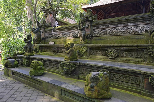 Outer wall with statues of various gods at the Pura Dalem Agung Padangtegal temple in Ubud Monkey Forest