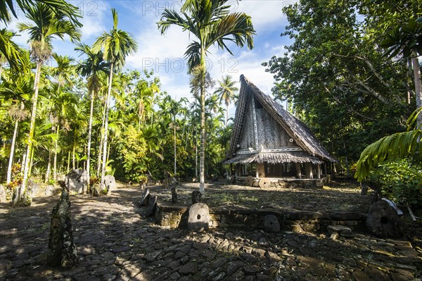 Traditional house with stone money in front