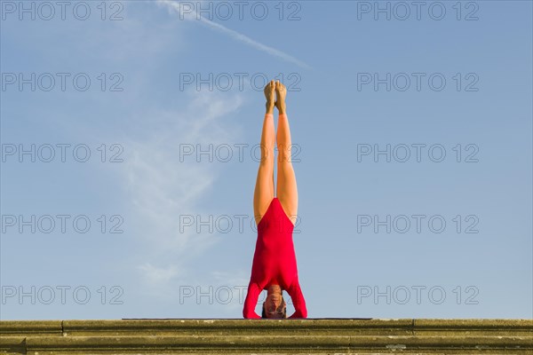 Young woman practising Hatha yoga