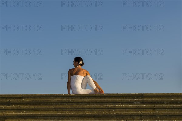 Young woman practising Hatha yoga