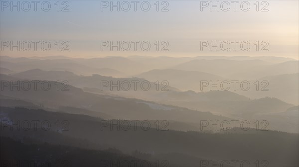 The hills of the northern Sauerland in the morning mist in Meschede