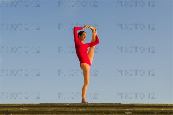 Young woman practising Hatha yoga