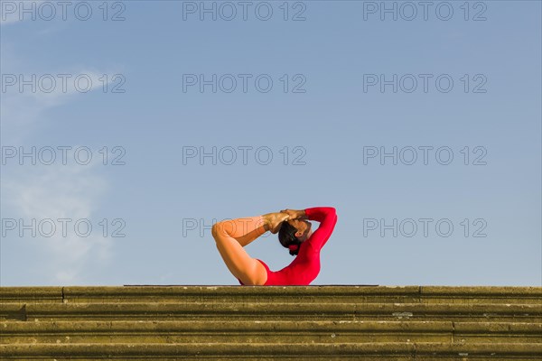 Young woman practising Hatha yoga