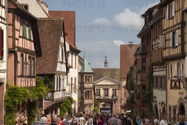 Half-timbered houses and tourists in the Rue du General du Gaulle